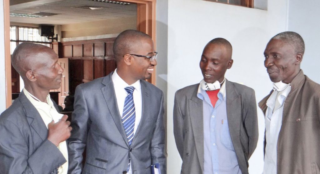 KELIN Executive Director, Allan Maleche with the petitioners Mr. Henry Ng'etich, Daniel Ngetich and Patrick Kirui.